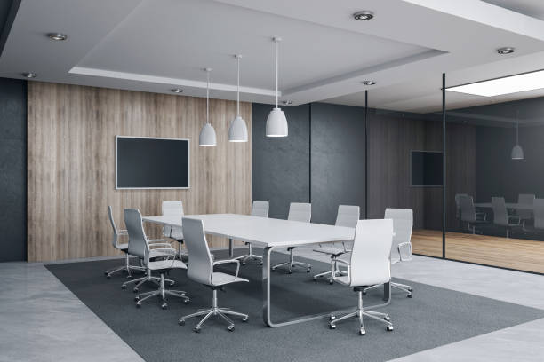 istock Modern meeting room interior with empty tv screen and sunlight. 1248785184