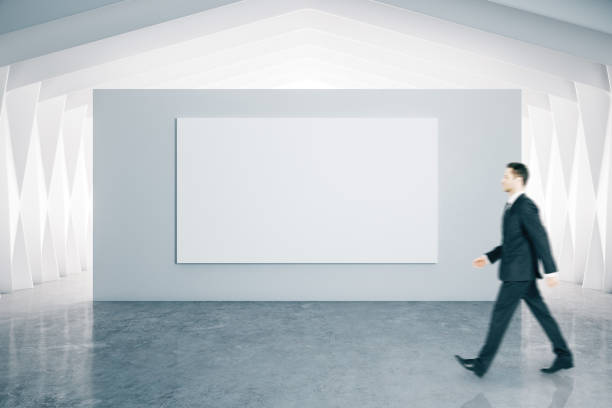 istock Businessman and blank poster 1248785218