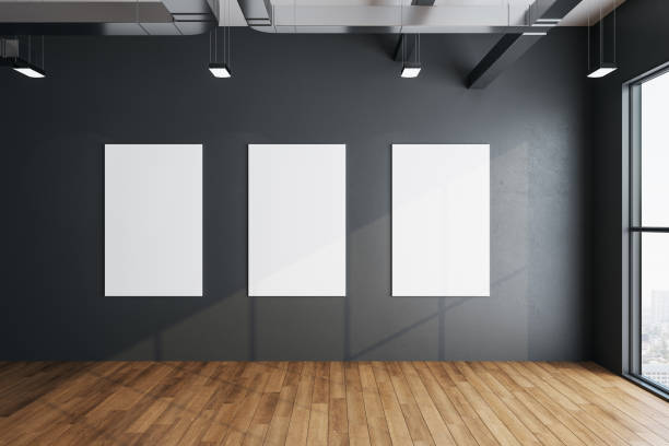 istock Exhibition hall room with three empty posters on concrete wall 1248786556