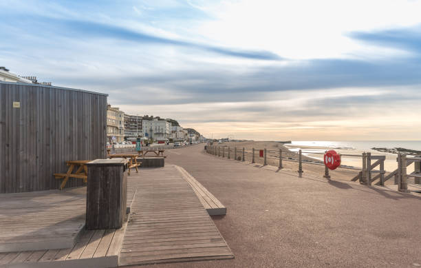 istock Promenade by Hastings shore with blue sky during evening. 1248786645