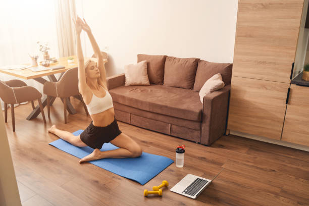 Woman performing a yoga exercise with eyes closed