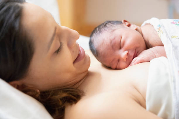 new born baby at hospital with mother stock photo