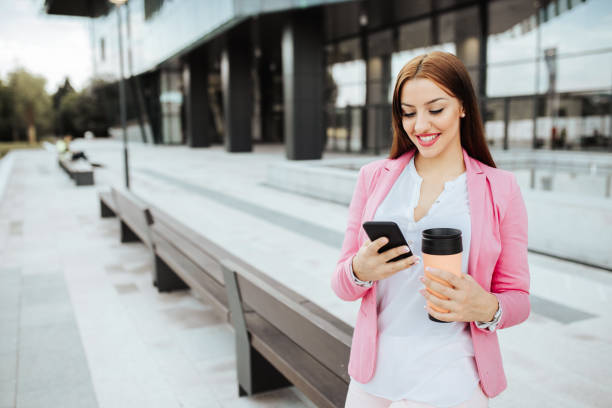 istock Young student in front of her place of work having a cafe break. 1248790865