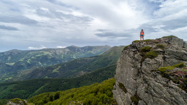 istock Young woman running on mountain 1248791977
