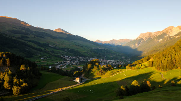 istock Sun is setting at the mountains surrounding Scuol (Graubünden, Switzerland) 1248792152