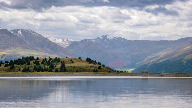 istock Small mountain lake near raised bog Plamort (South Tyrol, Italy) 1248795246