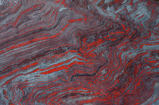 Banded iron formation from Ishpeming, Marquette County, Michigan. Layers of red chert and gray iron rich hematite