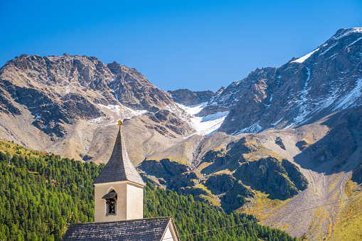 Looking at the church tower of Sulden (Italian: Solda), a mountain village in South Tyrol. Sulden (1,900 m) lies at the foot of the Ortler, in the Vinschgau valley east of the Stelvio Pass.