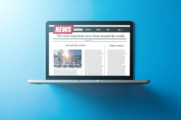 istock news on a computer screen. Mockup website. Newspaper and portal on internet 1248798071