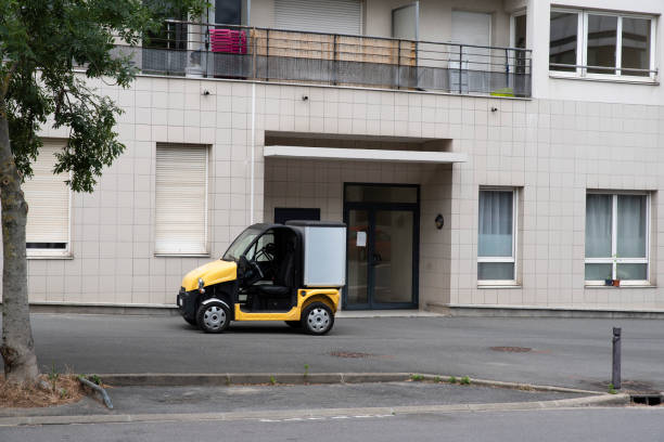 istock Postman's modern vehicle in France 1248798414