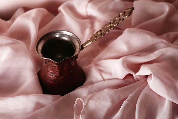 copper coffee turk on a wooden background