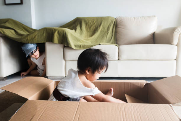 istock Boys build tent and pretend with cardboard box 1248803213