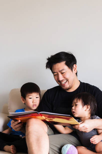 istock Father smiles as he reads 1248803215