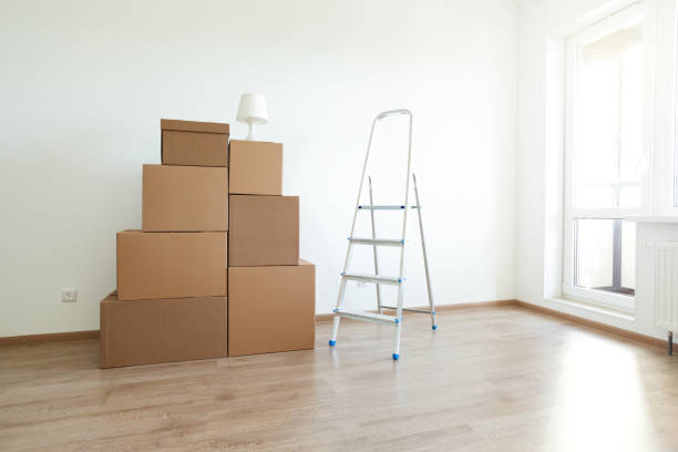 istock Cardboard boxes for moving in interior apartment, 1248806844
