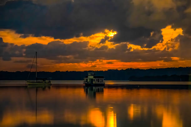 istock Red Moon behind the Storm Clouds over the Water 1248806848