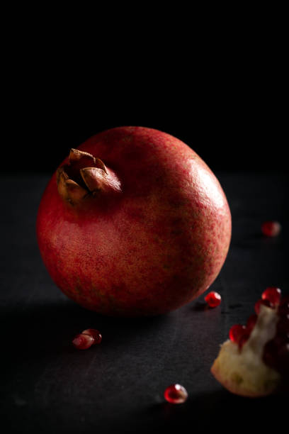 Pomegranate on dark background