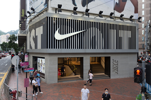 Hong Kong, Hong Kong - June 10, 2020 : People walk past the Nike Running store at Causeway Bay in Hong Kong.