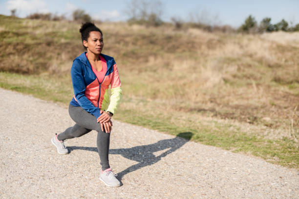 istock Woman doing stretching exercise in nature. 1248814038