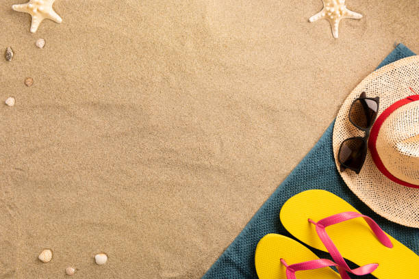 istock Beautiful summer holiday beach background with some accessories and shells on sand background 1248814159