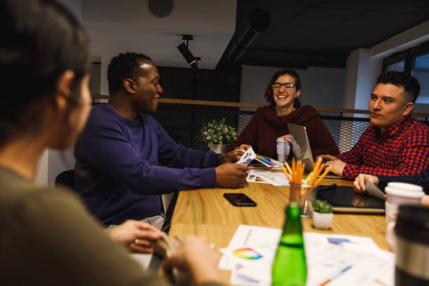 istock Positive graphic designers laughing during team meeting 1248826413