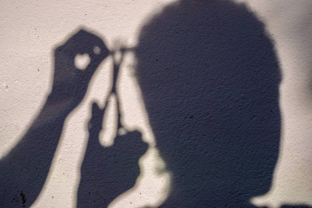 istock Shadow of man having a haircut at home 1248826582