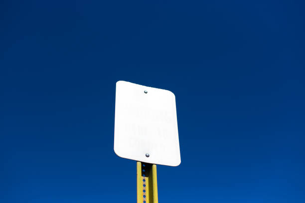 istock Blank White Road Sign Against Vibrant Blue Sky 1248829909