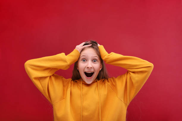 istock The girl is under a strong impression. Hold on to your head. 1248833574