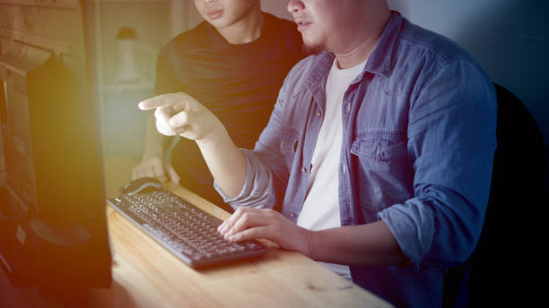 istock Happy father and his son shopping online on internet store, learning computer 1248839188