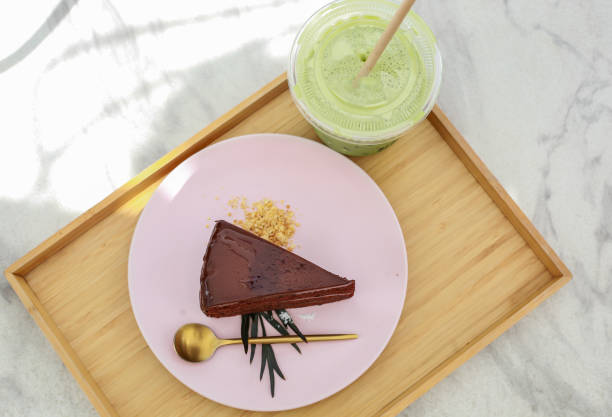 istock one piece of chocolate cake is placed on a white plate 1248843522