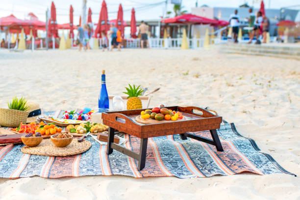 istock Beautiful summer picnic on the beach at sunset in zero waste style. Eco friendly idea for weekend staycations 1248845194