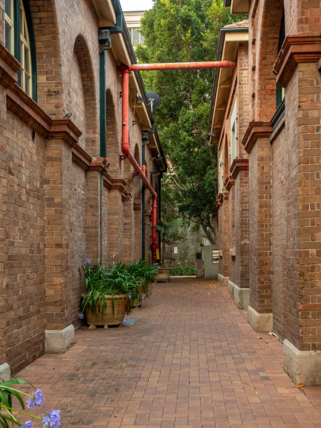 Brick Wall Building with Arched Details in Inner West of Sydney with cloudy sky Sydney NSW Australia December 27th 2019 - Facade of a Building at Vanardi Green in Rozelle, inner west of Sydney park designer label stock pictures, royalty-free photos & images