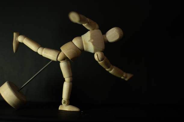 istock wooden mannequin splining run up on black background 1248853982