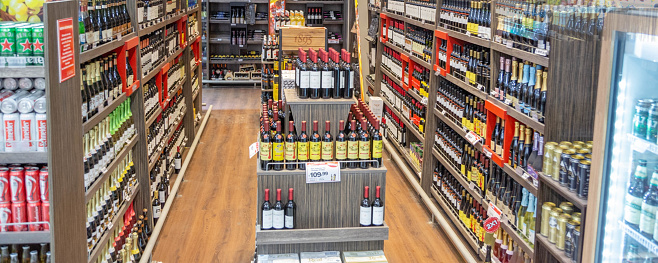 Empty supermarket corridor of wines, beers, liquors, alcohol drinks