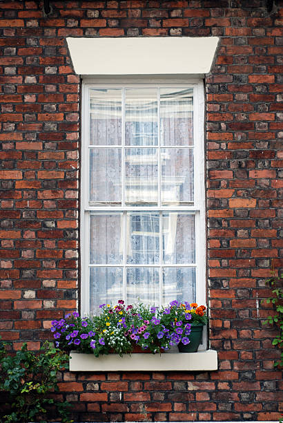 istock British window with coloured small flower vases 124885993