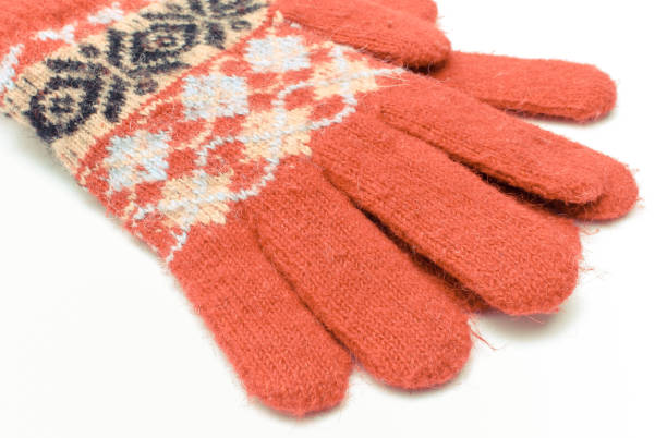 istock Red woolen gloves on white background. Womanly clothes 1248863371