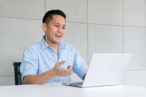 istock Businessman using laptop to video conferencing with colleagues via internet technology at home office 1248866962
