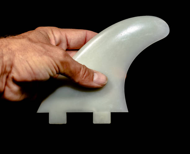 istock Surfboard fins on a black background 1248868771