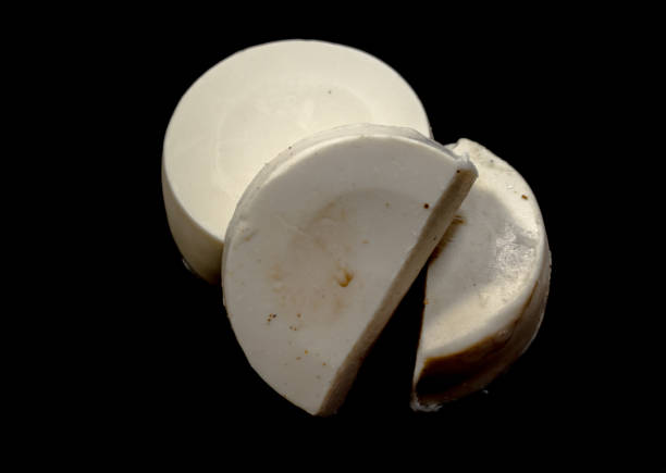 Surf board wax, blocks of surf wax, white round wax, black background.