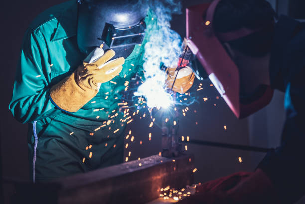 istock Metal welding steel works using electric arc welding machine 1248870314