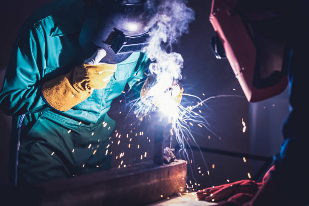 istock Metal welding steel works using electric arc welding machine 1248870332