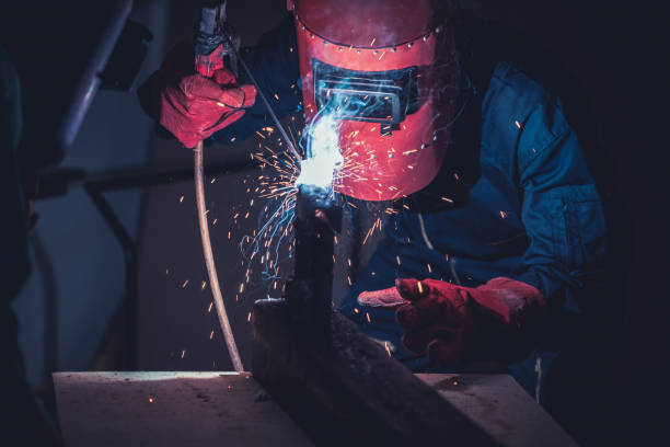 istock Metal welding steel works using electric arc welding machine 1248870384