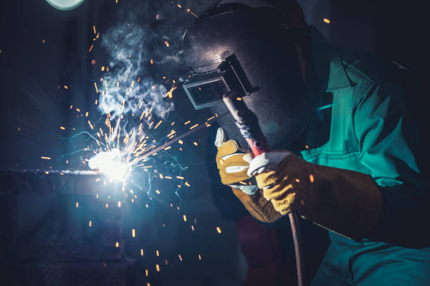 istock Metal welding steel works using electric arc welding machine 1248870445