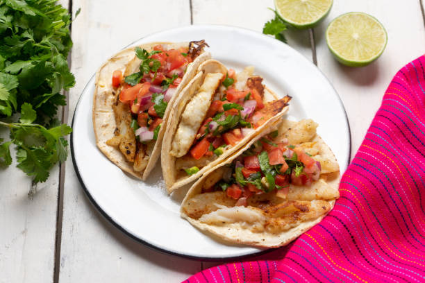 istock Mexican fish tacos also called Baja with fresh sauce on white background 1248871691