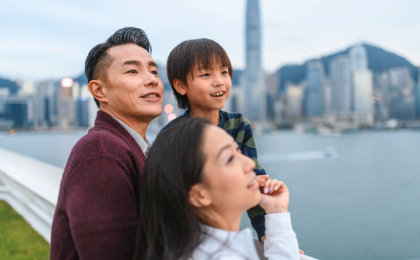 istock Young Chinese Family Enjoying View from Ocean Terminal Deck 1248873606