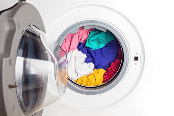 istock Washing or drying machine loaded with the laundry. Washing, spring cleaning idea 1248873738