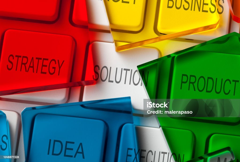 Solution. Computer keyboard with colored pieces of a puzzle. Strategy, Solution, Product, Idea, Execution, Business. Computer keyboard with pieces of a puzzle. Marketing Stock Photo