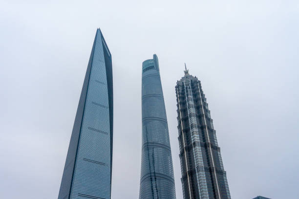Shanghai, China - May 10, 2020: The Skyscrapers in Lujiazui financial district of Shanghai China. The Shanghai Center Tower, Jin Mao Tower and Shanghai World Financial Center. Walk along the building
