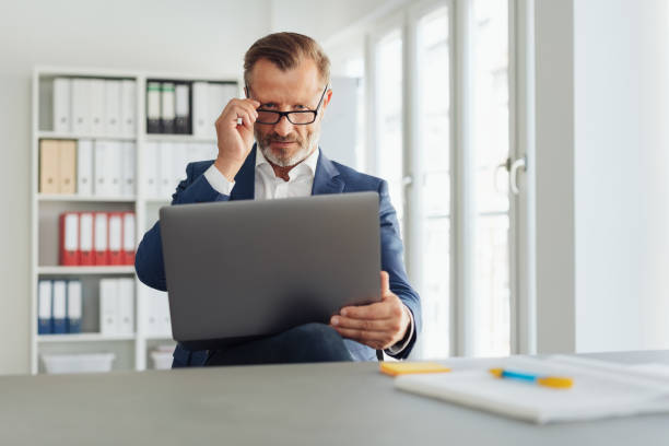 istock Business analyst or specialist seated in an office 1248878715