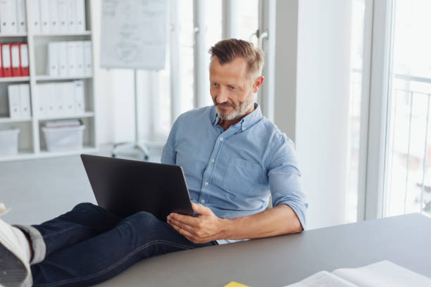 istock Laid-back businessman working with his feet up 1248878972