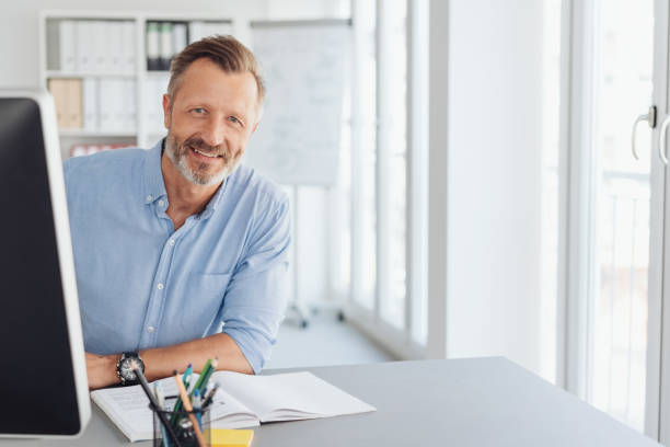 istock Friendly sincere businessman looking at camera 1248878992